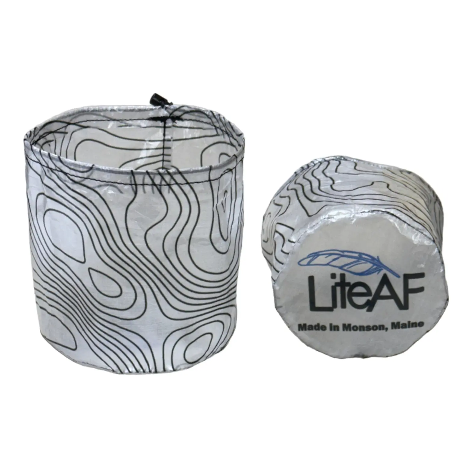 Two gray paper towel rolls with black contour-line patterns; one standing upright and the other lying on its side, showing packaging that reads 'LiteAF' and 'Made in Monson, Maine'