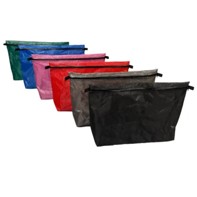 Set of colorful zipper pouches arranged diagonally from green to black, each with a black zipper pull (cosmetic/organization bags).