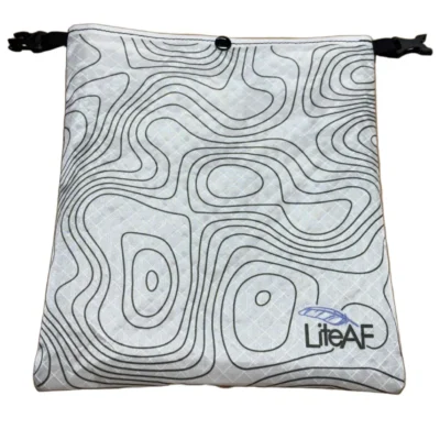 Gray drawstring bag featuring an abstract topographic line pattern and a small LifeAF logo in the lower-right corner, with black cord closures at sides.