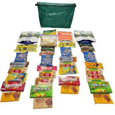 Green reusable bag above a neatly arranged display of assorted snack packets on a white background, forming four columns beneath the bag.