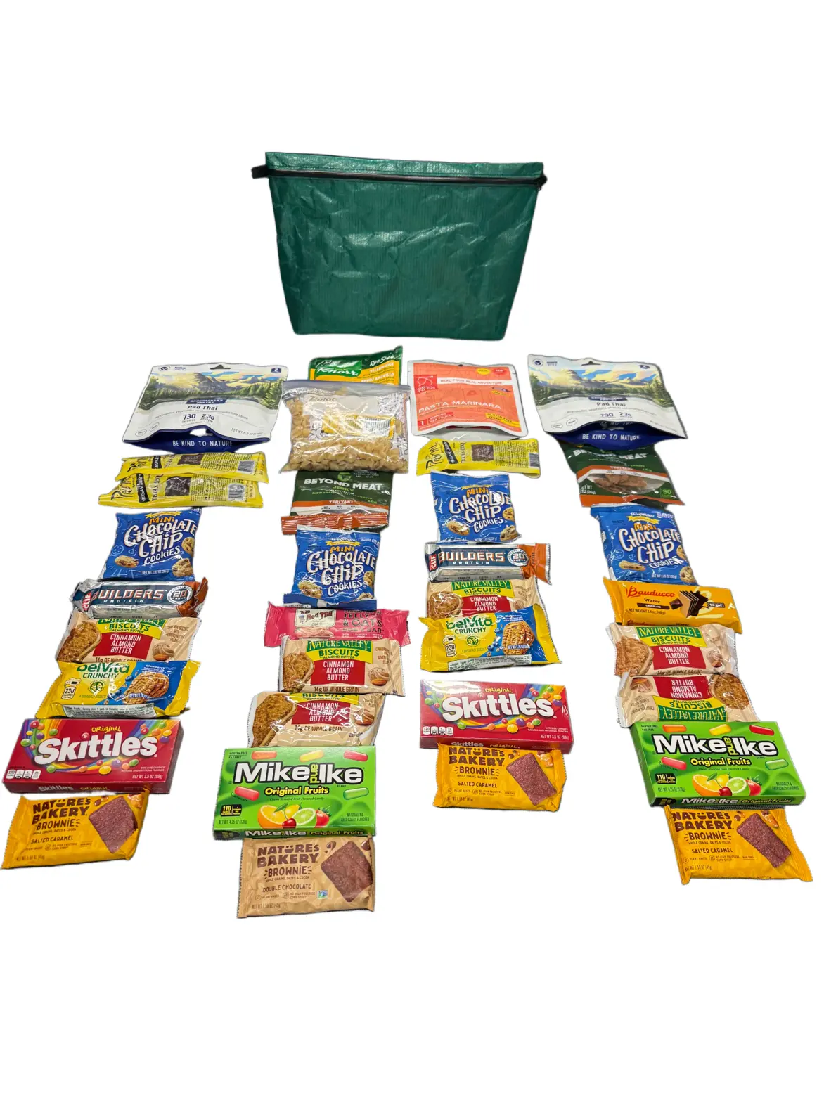 Green reusable bag above a neatly arranged display of assorted snack packets on a white background, forming four columns beneath the bag.